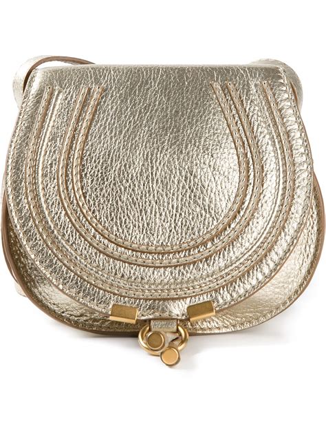 small gold crossover handbags.